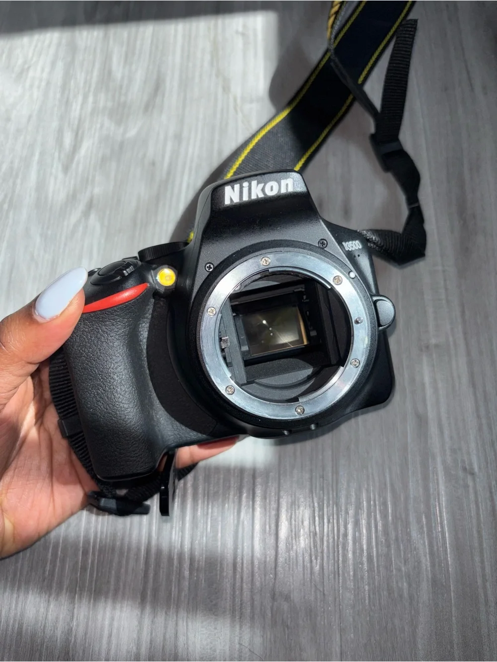 Nikon D3500 Black DSLR Camera with Black Zoom Lens and Red Accent